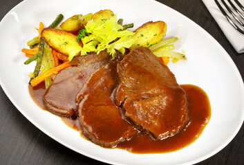 Braised Beef Roast with Vegetables and Potato Wedges