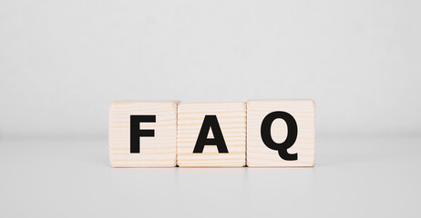 text of FAQS on wooden cubes, faq concept.
