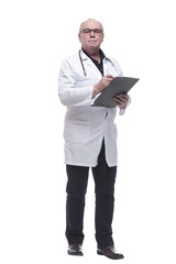 in full growth. serious doctor taking notes in the clipboard