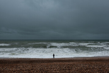 A man silhouette by the sea, Brighton, England 
