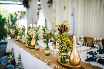 Table decoration for a special occasion -  boho wedding table set up. Outdoor wedding/party