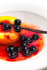 detail of caramelized peach with blueberries