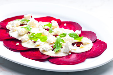 fresh beetroot and apple salad with fresh goat cheese and arugula