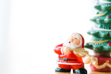 Santa sing a song on Christmas caroling day or Carolers singing outside with snows.Group of Santa...