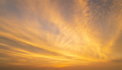 Abstract amazing Scene of stuning Colorful sunset with Moving clouds background in nature and travel concept, wide angle shot Panorama shot.