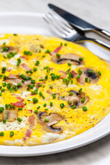 egg omelette with mushrooms and bacon