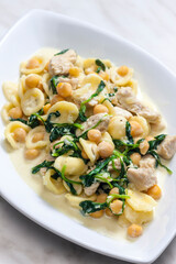 pasta orecchiette with chicken meat, chick peas and spinach