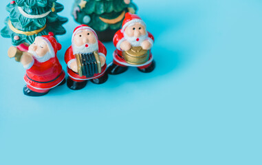 Santa claus sing a song on Christmas caroling day or Carolers singing with snows.Group Santa claus play music sing Christmas song on celebration of christmas day party in winter.Celebration Holidays.