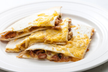 quesadilla filled with beans and chedar cheese
