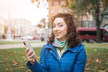 Girl student holds a smartphone