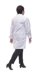 side view. medical woman confidently striding forward