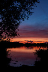 Sunset over the pond Rezabinec near Pisek town, Southern Bohemia, Czech Republic