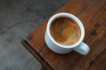 A cup of coffee on a wooden table             