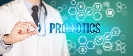 Close-up of a doctor giving you a pill with PROBIOTICS inscription, medical concept