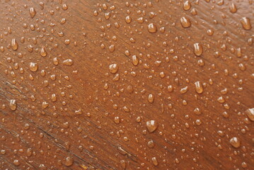 wooden lacquered background with water drops