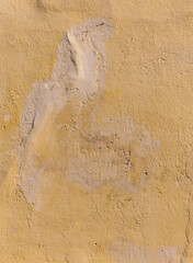 an old wall painted in yellow