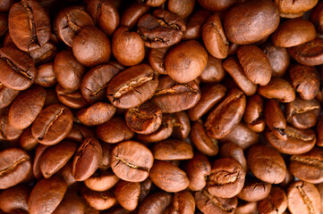 Roasted coffee beans texture background close up