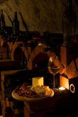 Traditional food in a wine cellar with archival wine, Znojmo region, Southern Moravia, Czech Republic
