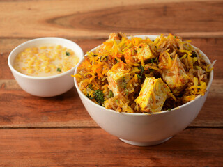 Hyderabadi Veg Paneer Dum Biryani with mixed veggies like Paneer, Potato, Carrots, Peas cooked...