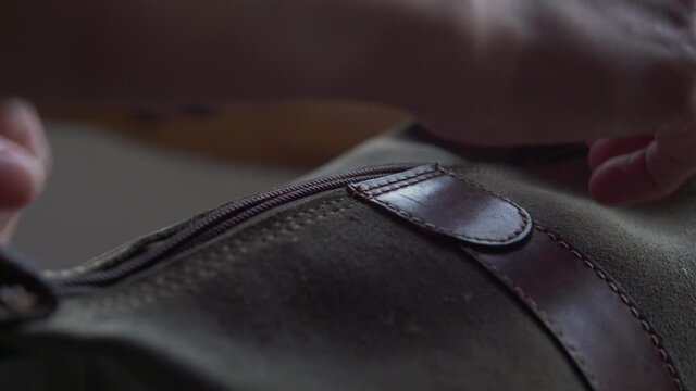woman hands opening purses zipper