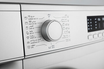 Details of digital display and washing machine volume on white background