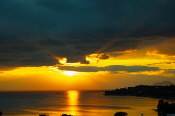 sunset, golden hour, the sun sets on the sea