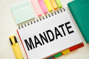 the word mandate is written on a notepad. concept of human right to anything