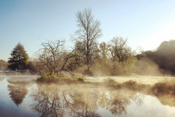 A still River Wey on a cold sunny morning in Godalming, Surrey, UK