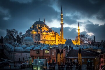 Night Suleymaniye Mosque against dramatic sky. It's an Ottoman imperial mosque located on the Third...