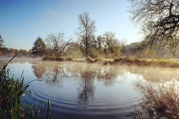 A still River Wey on a cold sunny morning in Godalming, Surrey, UK