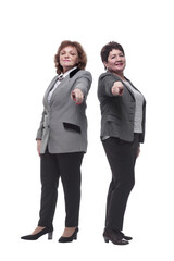 two mature women in casual clothes looking at you.