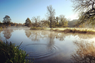 A still River Wey on a cold sunny morning in Godalming, Surrey, UK