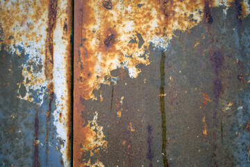 Old rusty metal texture with peeled paint.