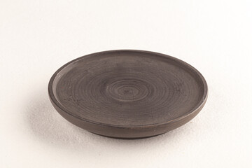 Grey wooden plate on the white background