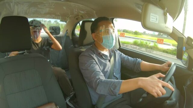 Uber Driving During Coronavirus Pandemic, Wearing Face Mask And Face Shield