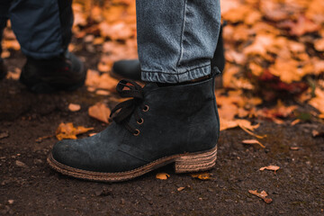 Dark suede shoes  close up on woman foot.  autumn shoes.