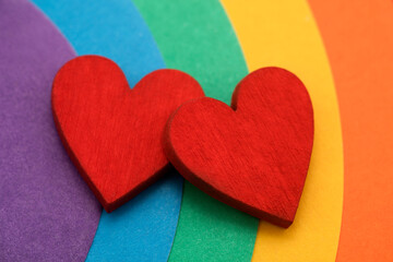 Two hearts on a colorful rainbow background