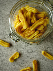 Indonesian snack. Close-up of cheese soes crackers or crisps in bowl against white background. Very delicious for snacks while watching movies