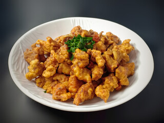 Crispy Chicken with Salted Egg Yolk Sauce. Made from chicken fillets, wrapped in flour, fried, covered with salted egg yolk seasoning. Very tasty and delicious. 