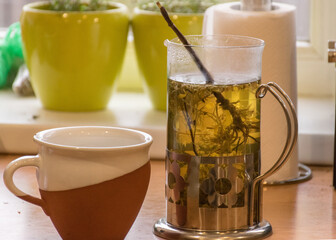 still life with a kettle and a cup of tea, relaxation, autumn