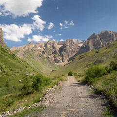 Valley in the Pyrenees with mountains in the background.