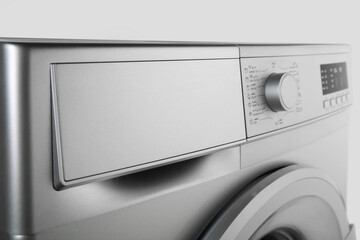 Details of digital display and washing machine volume on white background