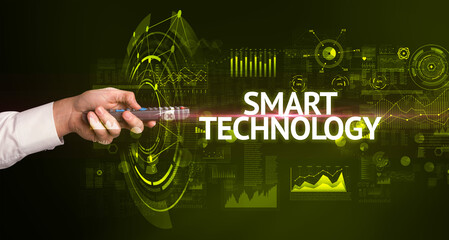 hand holding wireless peripheral with SMART TECHNOLOGY inscription, modern technology concept