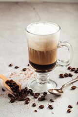 Coffee moccacino with chocolate in a glass mug