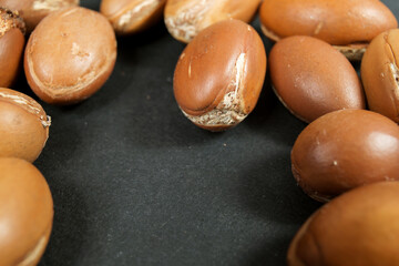 argan tree nuts close up on a dark background