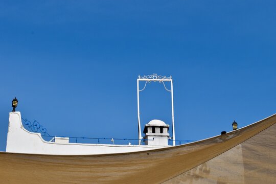 Rooftop and lanterns of a traditional white Bodrum house