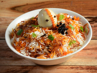 Egg Biryani - Basmati rice cooked with masala and spices and served with boiled eggs, selective focus