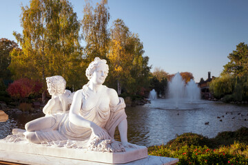 Ancient statue of Aphrodite and Cupid in the park