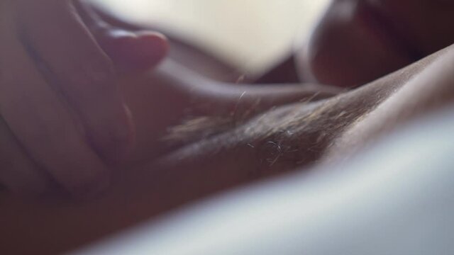 woman touching her hairy armpit