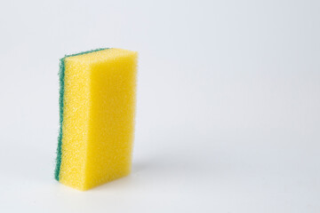 Colored sponges for washing dishes on a white background.